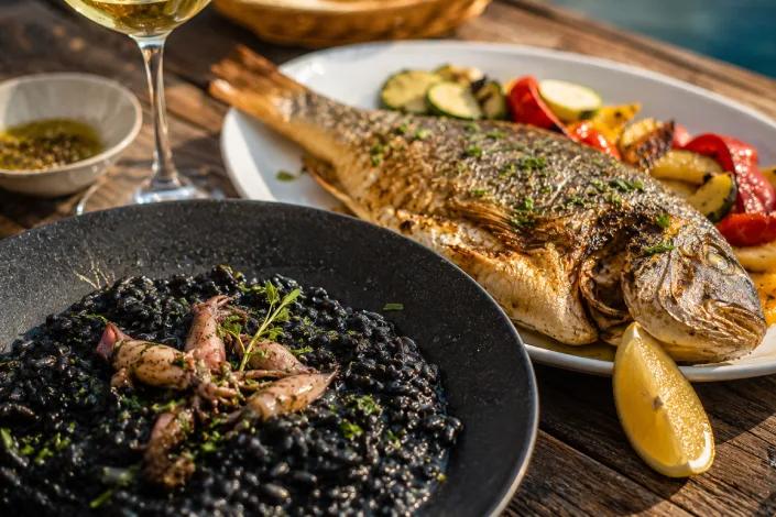Croatian cuttlefish black risotto and grilled fish